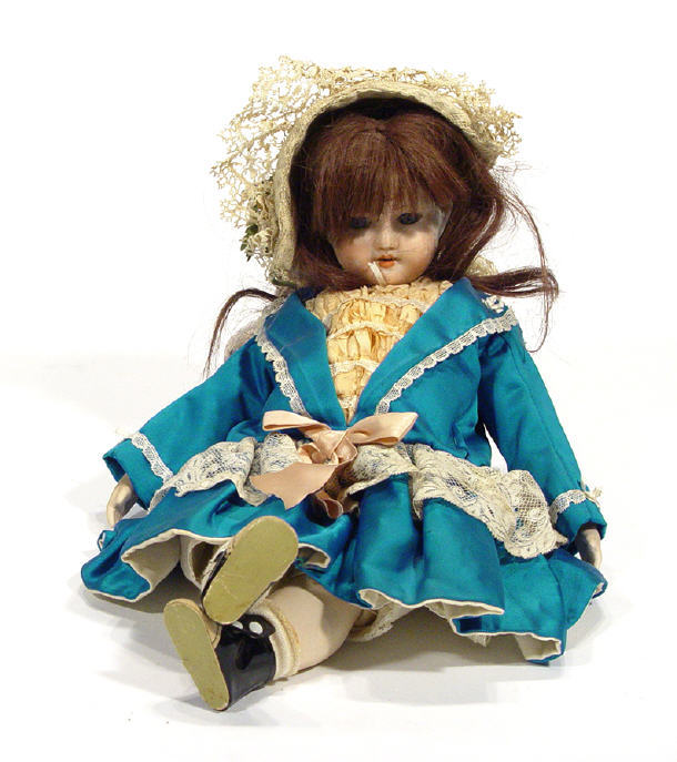 Appraisal: Bisque headed and limbed child's dolls in dress with lace