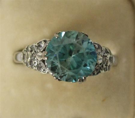 Appraisal: A zircon and diamond ring set in white metal the