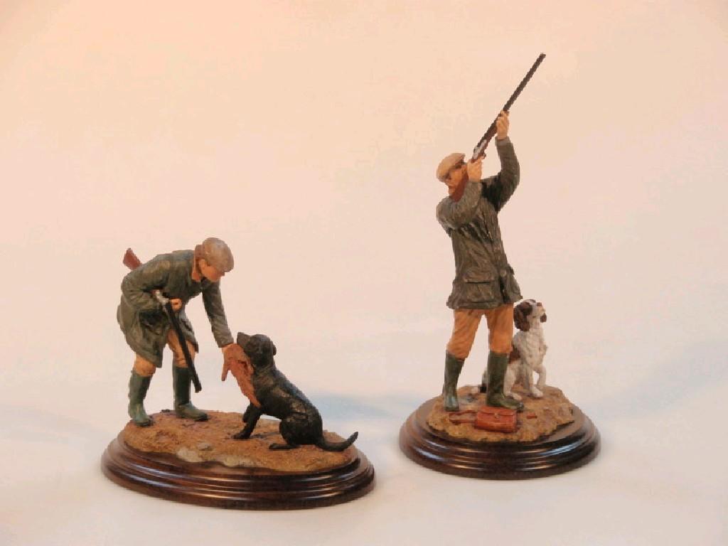 Appraisal: Two Country Artists hand painted models of huntsmen with dogs