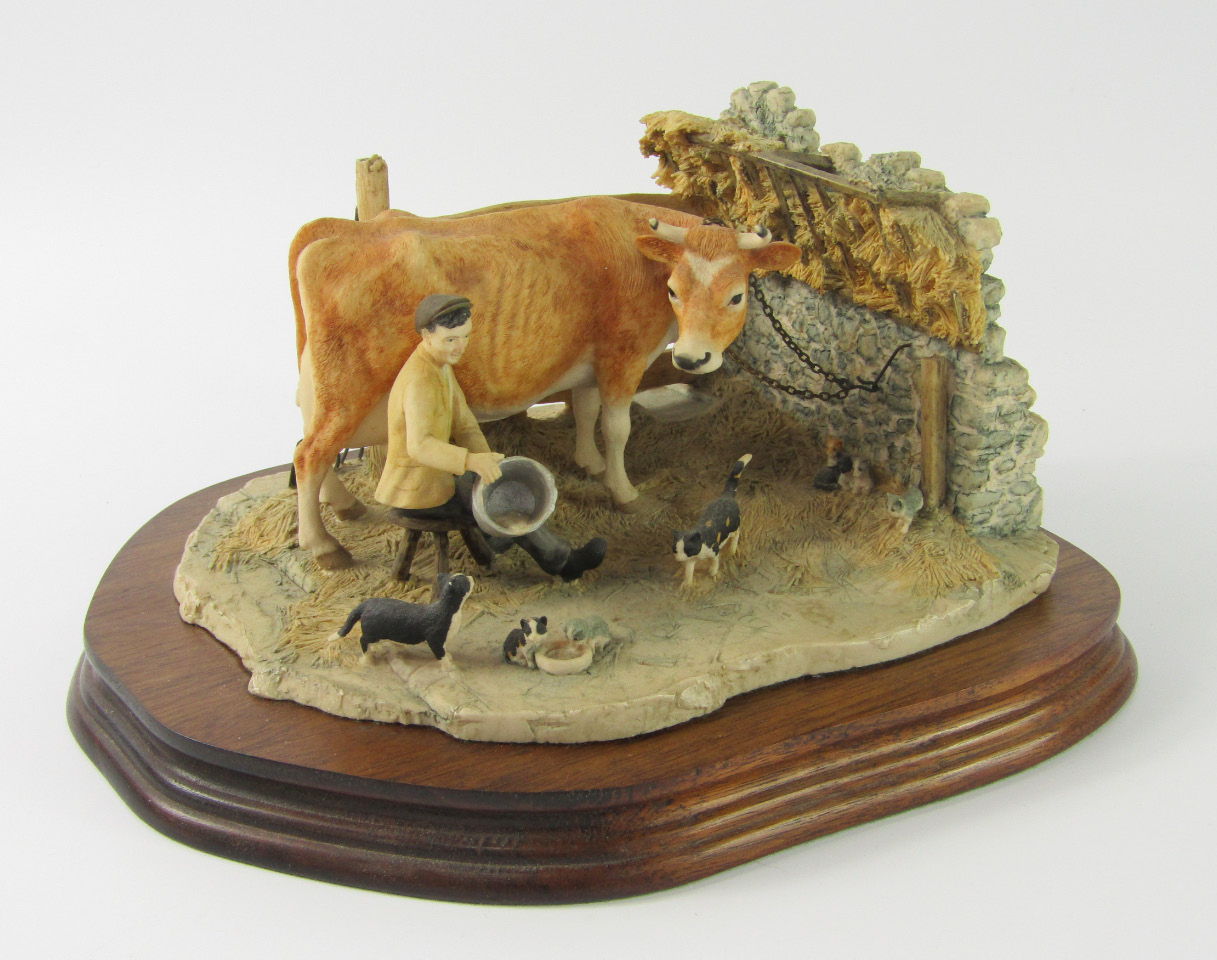 Appraisal: A Border Fine Arts sculpture of a cow being milked