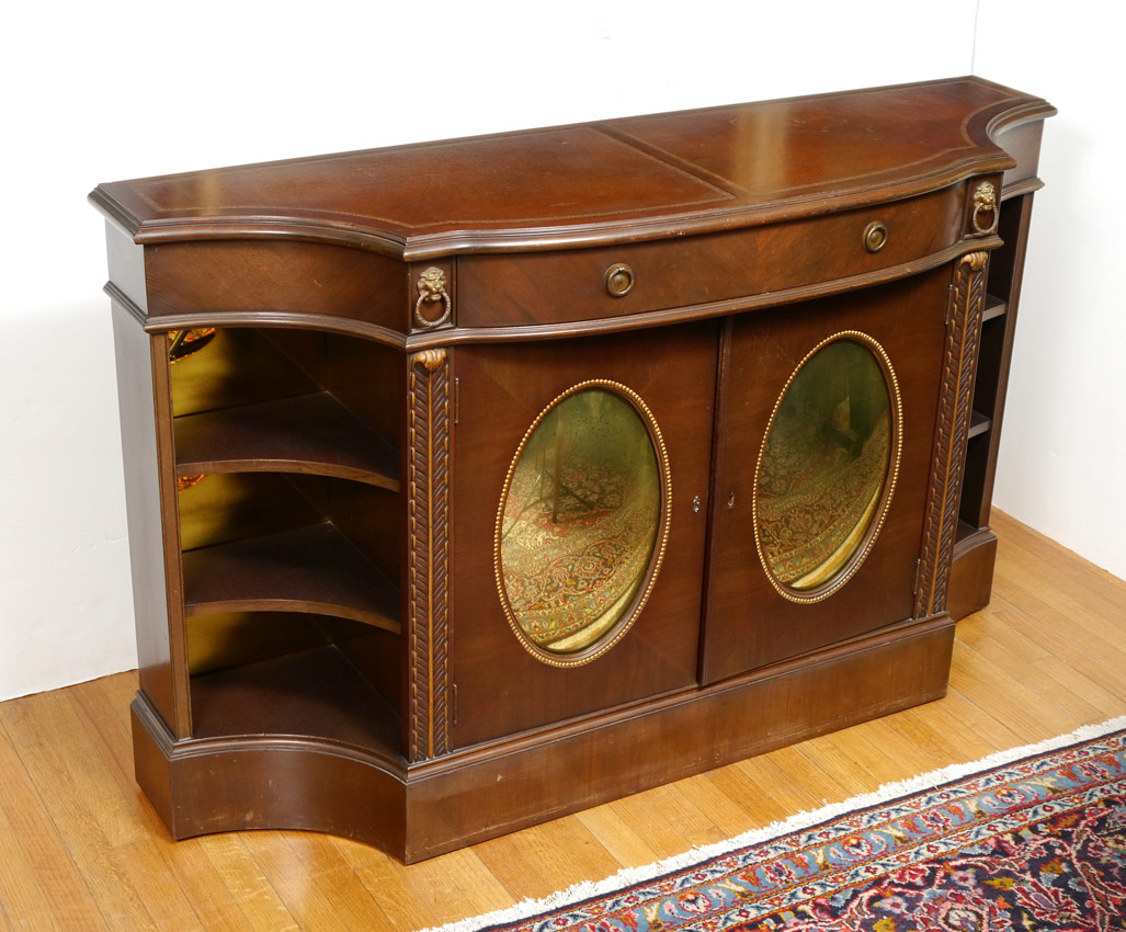 Appraisal: LEATHER TOP MAHOGANY CREDENZA Shaped top with double embossed leather