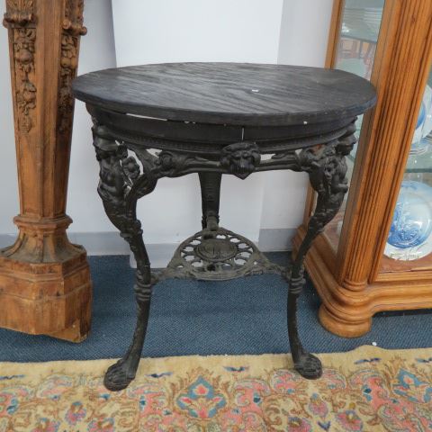 Appraisal: Cast Iron Pub Table th century maidens and English shield