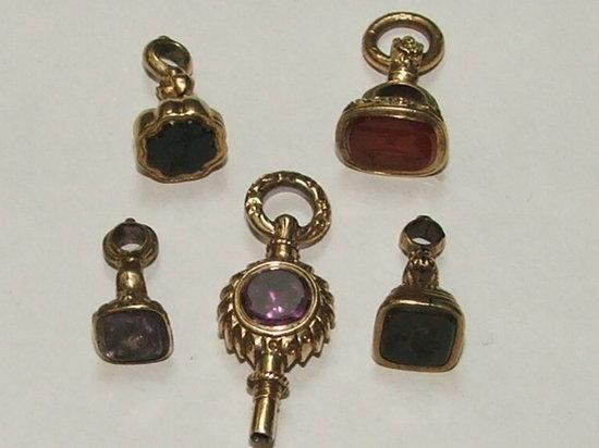 Appraisal: A GROUP OF FOUR ENGRAVED FOB SEALS and a gem