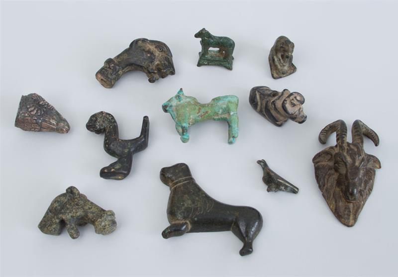 Appraisal: LARGE GROUP OF ANCIENT BRONZE ANIMALS Ram's head x x