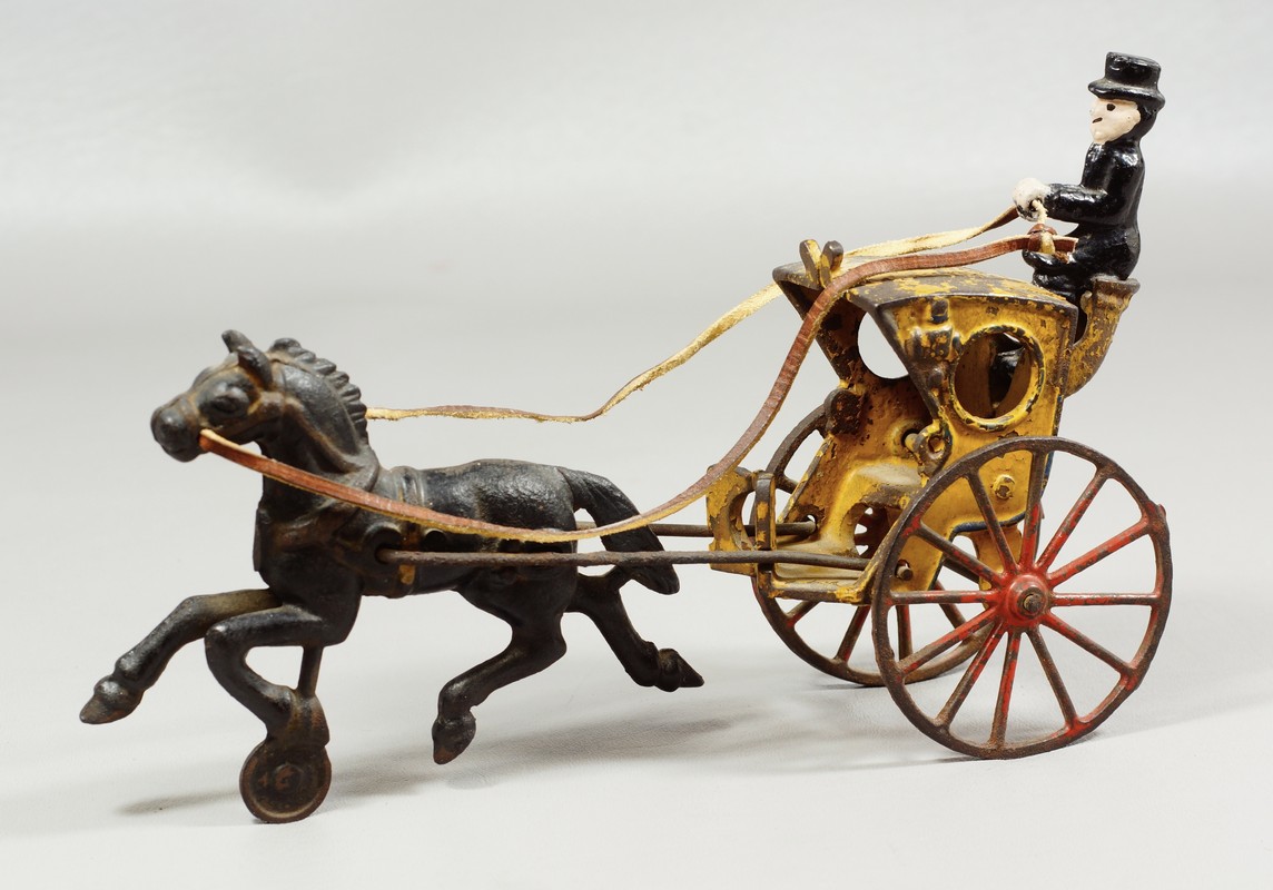 Appraisal: Cast iron Kenton hansom cab with driver yellow body and