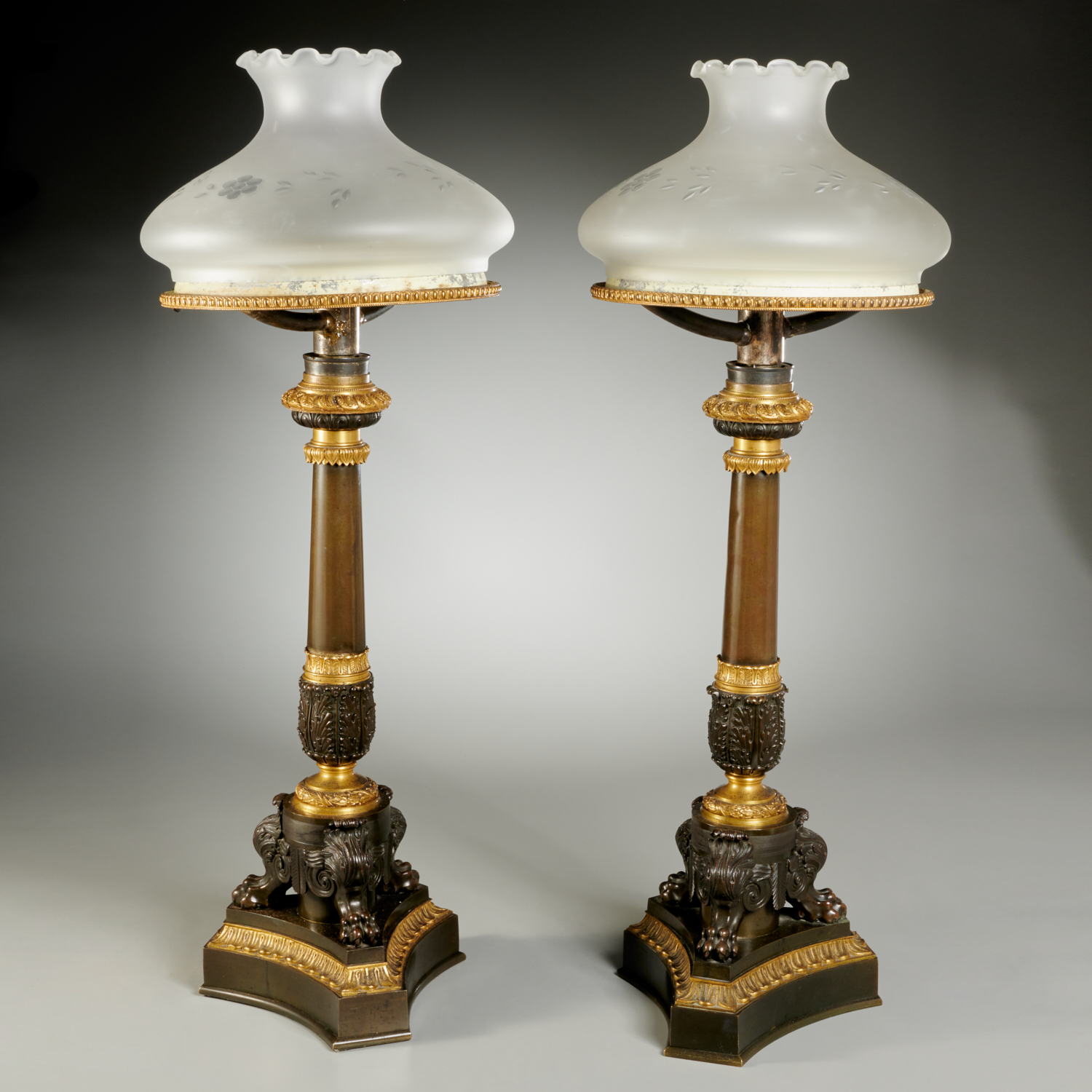 Appraisal: PAIR RESTAURATION BRONZE SINUMBRA LAMPS th c France converted to