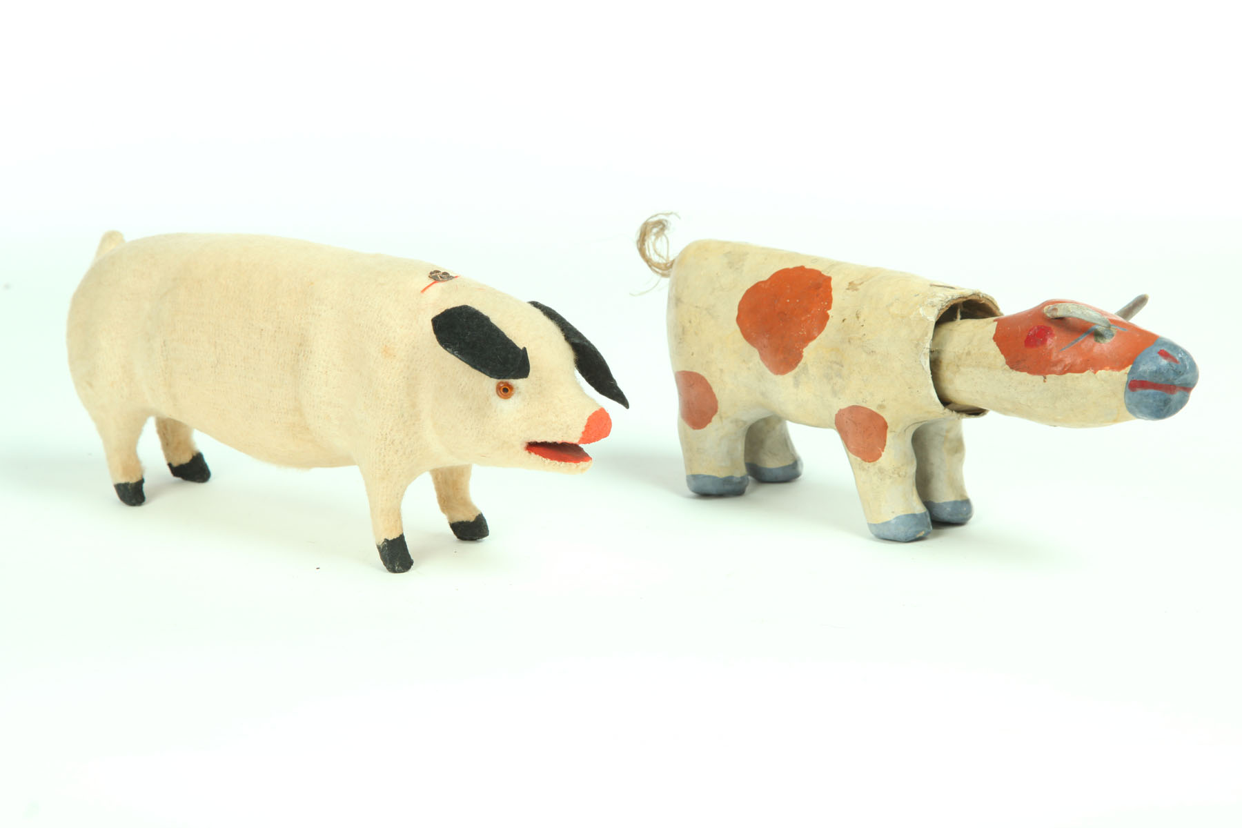 Appraisal: TWO TOYS American late th-early th century Papier mache cow