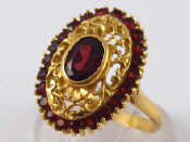 Appraisal: A yellow metal tests carat gold garnet ring head approx