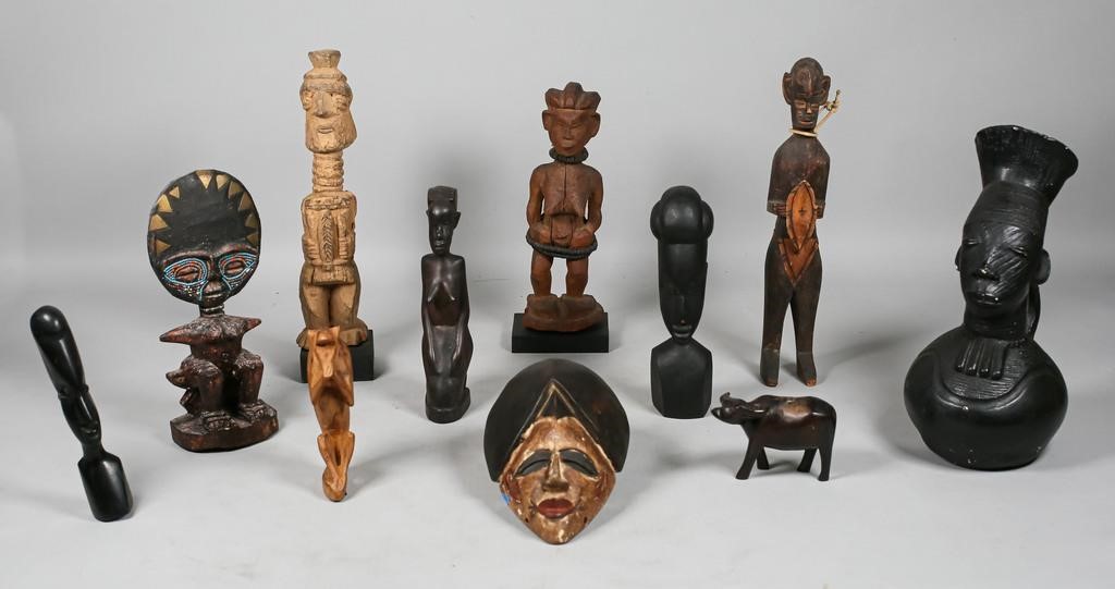 Appraisal: African decorative pieces wood carved statues ceramic figural ewer and