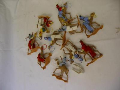 Appraisal: Ten Timpo plastic Arabs with swords mounted on camels G-E