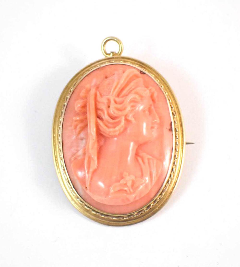 Appraisal: CARVED OCEAN CORAL AND FOURTEEN KARAT GOLD PENDANT BROOCH high