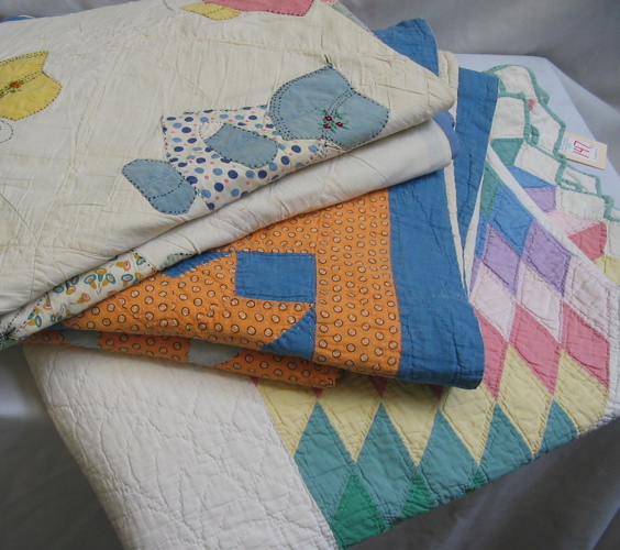 Appraisal: A GROUP OF THREE AMERICAN PATCHWORK QUILTS One in a