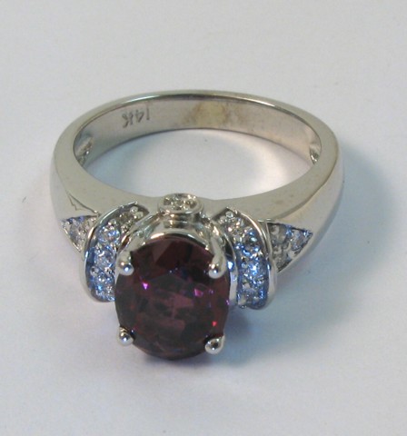 Appraisal: GARNET DIAMOND AND WHITE GOLD RING The k white gold