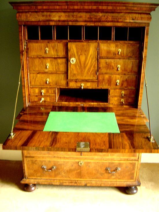 Appraisal: Early th century walnut and herringbone banded secretaire with cushion