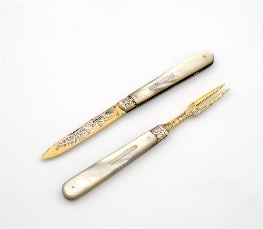 Appraisal: A Victorian silver-gilt folding fruit knife and fork