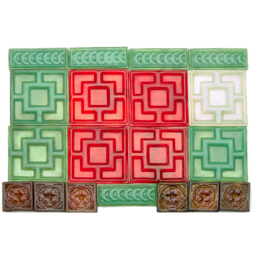 Appraisal: TIFFANY Nineteen glass tiles in three sizes and four colors