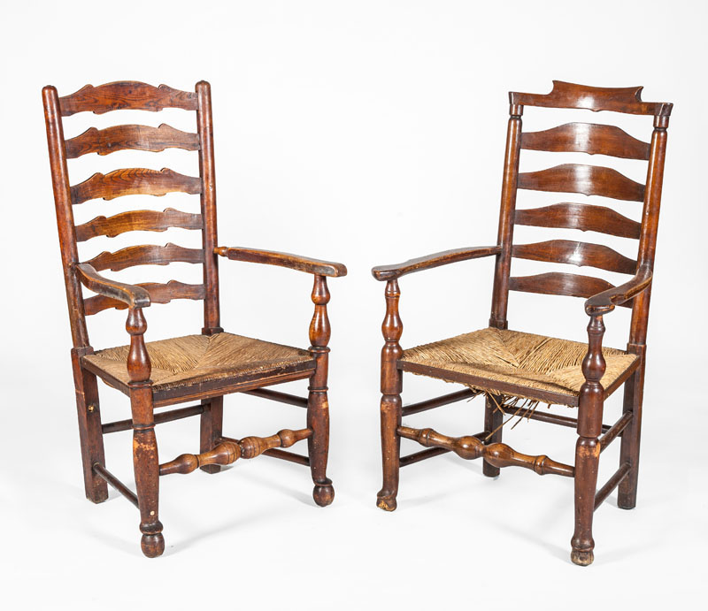 Appraisal: TWO OAK LADDER BACK ARMCHAIRS Both with rush seats x