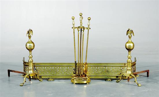 Appraisal: Brass fireplace accessories consisting of pair of andirons pierced fender