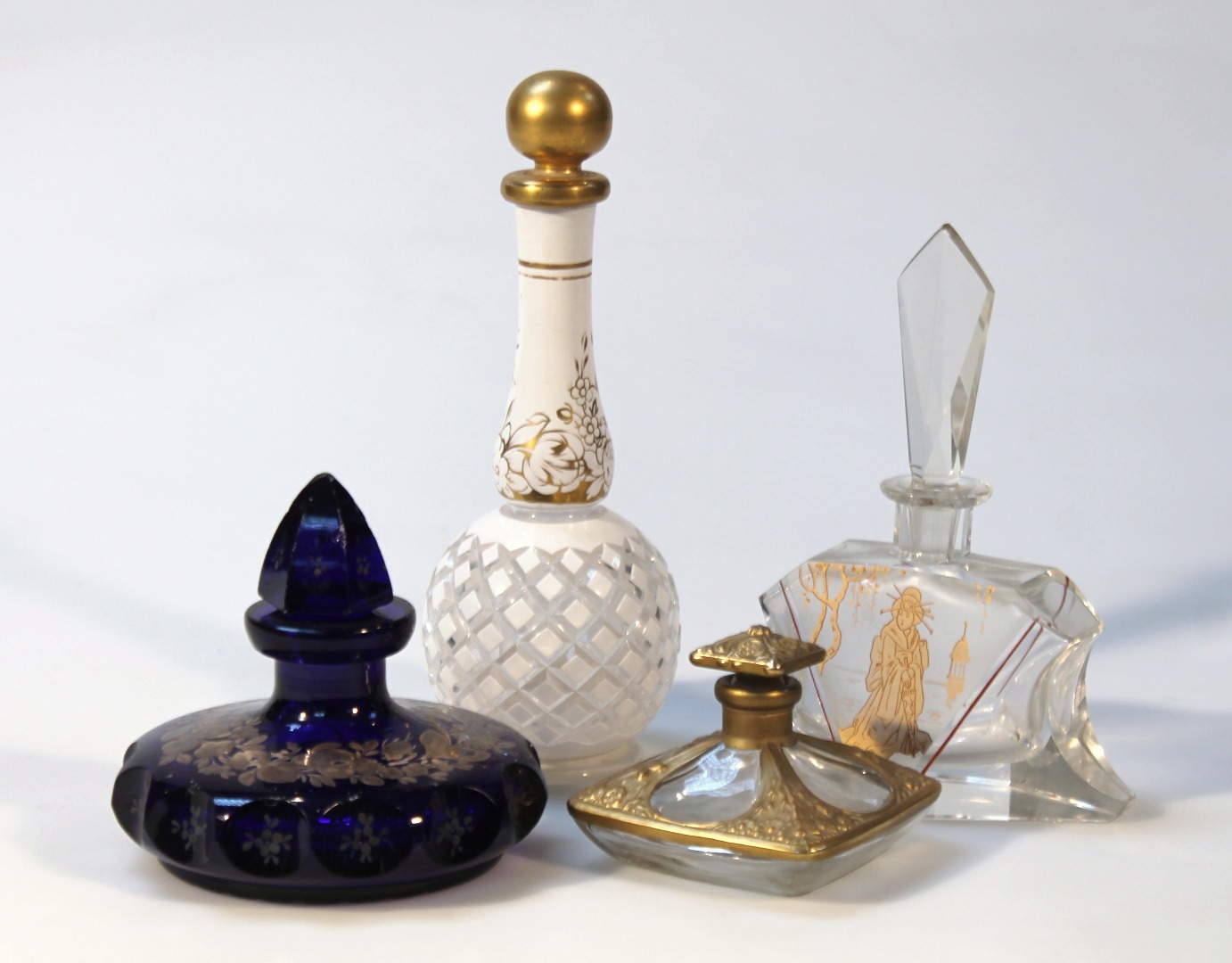 Appraisal: Various scent bottles to include a shaped example gilt highlighted