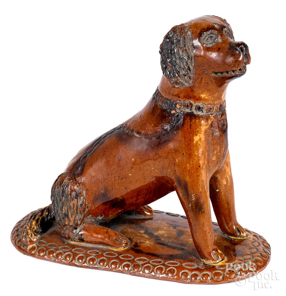 Appraisal: Pennsylvania redware seated dog th c Pennsylvania redware seated dog