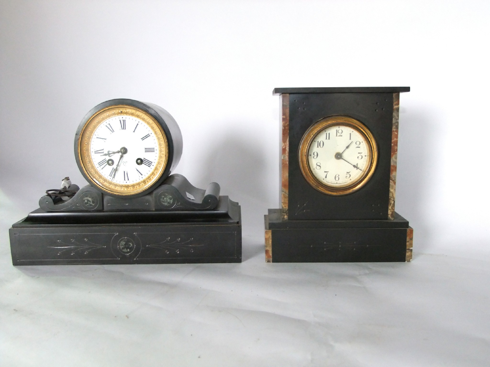 Appraisal: A Victorian black slate mantle clock the drum movement set