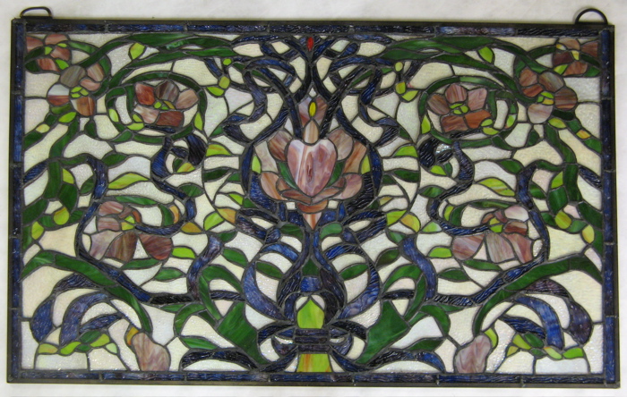 Appraisal: A STAINED AND LEADED GLASS WINDOW PANEL having a heart-shaped