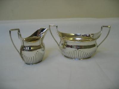 Appraisal: A VICTORIAN SUGAR AND CREAM SET of oval half fluted