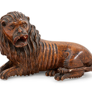 Appraisal: A Carved Wood Figure of a Lion th Century Height