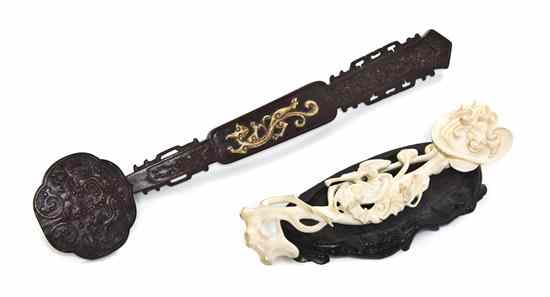 Appraisal: A Bone Inset Hardwood Ruyi Scepter having raised scrolling decoration