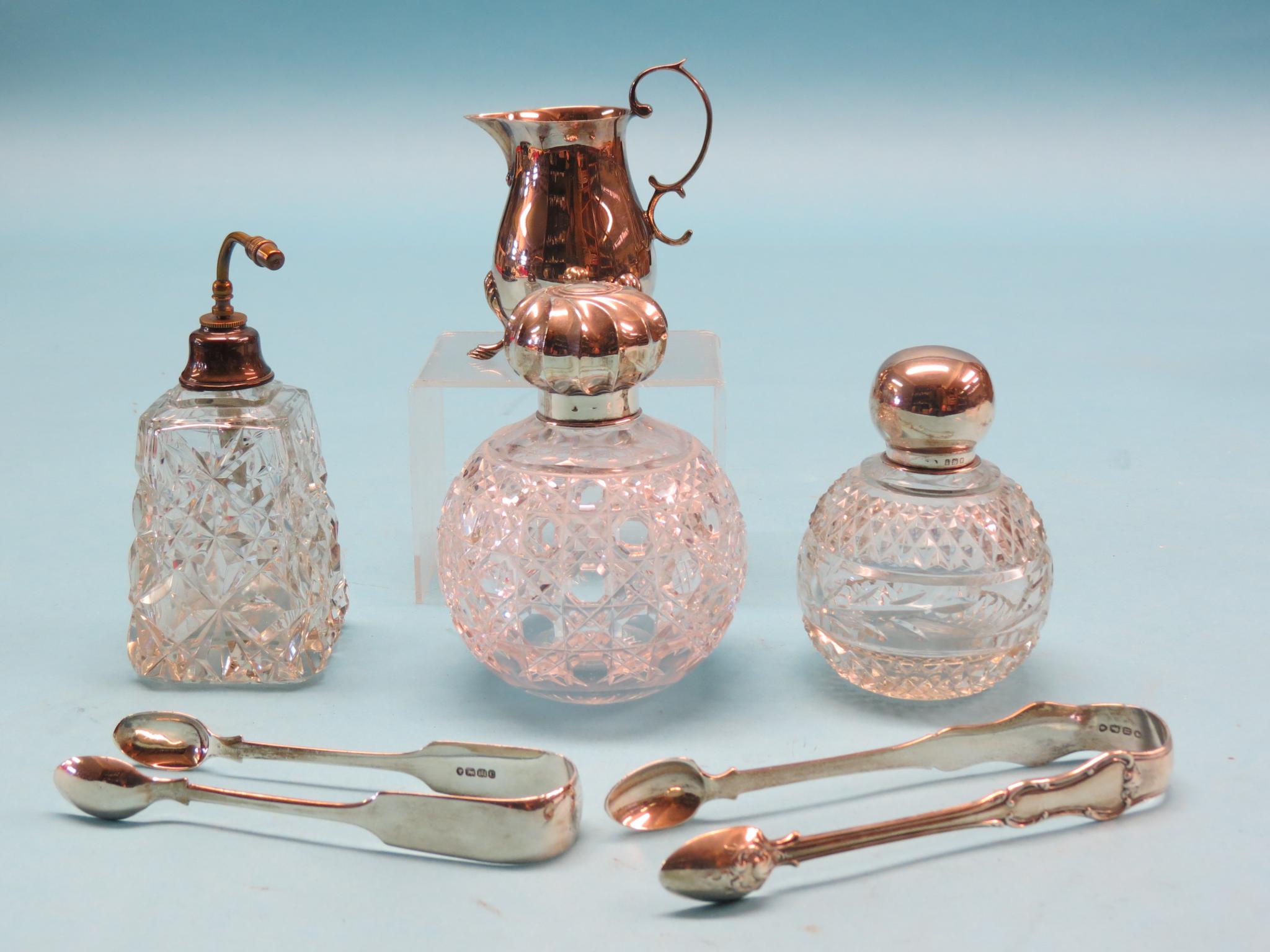 Appraisal: Small silverware cream jug three glass scent bottles with silver