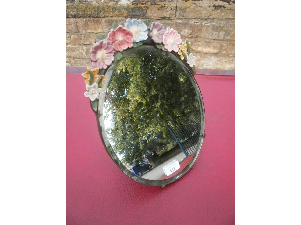 Appraisal: A 's style oval dressing mirror the crest decorated in