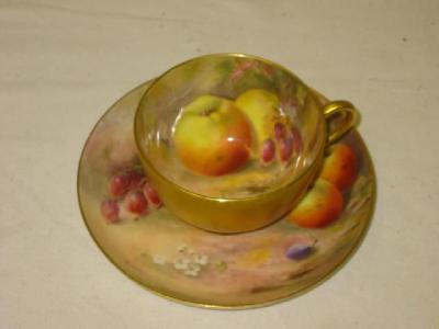 Appraisal: A ROYAL WORCESTER PORCELAIN CUP AND SAUCER painted with fruit