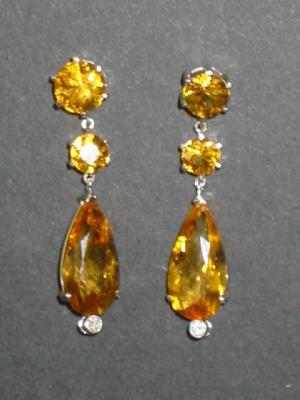 Appraisal: A PAIR OF CITRINE EARRINGS comprising faceted pear drop hanging