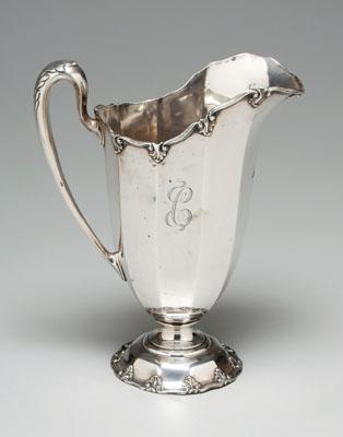 Appraisal: Sterling water pitcher paneled sides scroll and acanthus border and