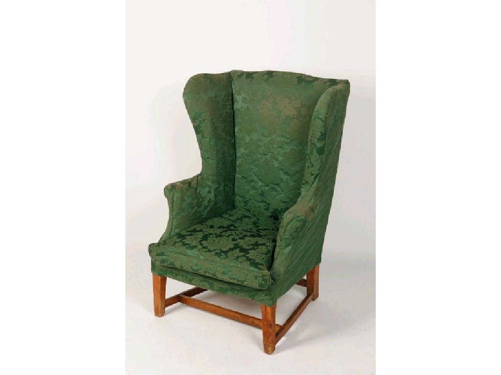 Appraisal: A GEORGE III WING ARMCHAIR the raised wing back above