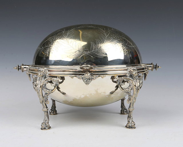 Appraisal: A SILVER PLATED BREAKFAST DISH with hinged cover and cast