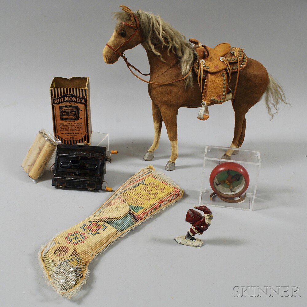 Appraisal: Small Group of Toys a doll-sized horse with stamped leather