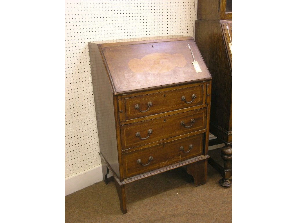 Appraisal: An Edwardian inlaid mahogany bureau fall-front enclosing fitted interior above