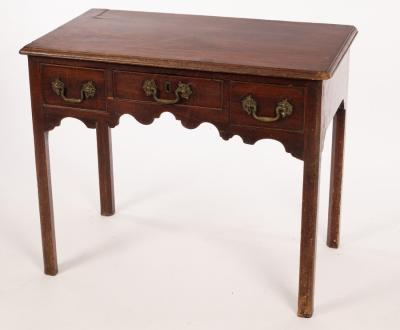 Appraisal: A George III mahogany lowboy fitted three drawers above a