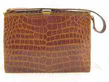 Appraisal: A lady's tan crocodile skin handbag with suede leather lining