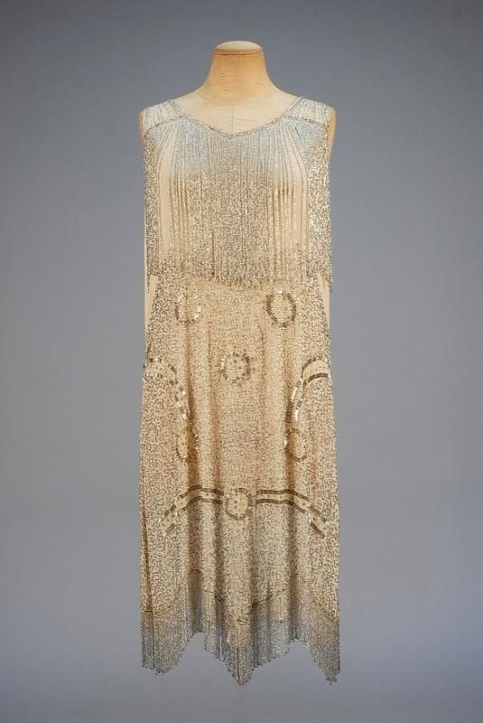 Appraisal: BEADED SILK FLAPPER DRESS s Sleeveless cream chiffon decorated with