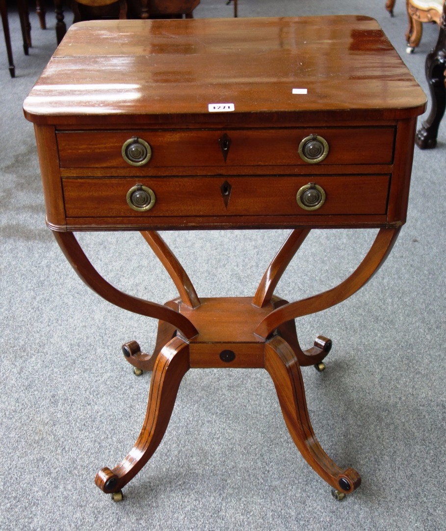 Appraisal: An early th century mahogany two drawer side table on