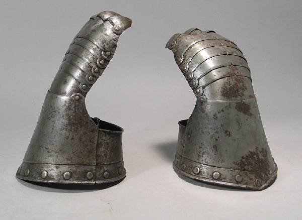 Appraisal: A pair of reproduction gauntlets Having pointed cuffs with rolled