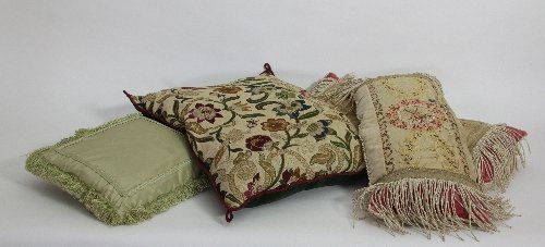 Appraisal: A pair of bolster type cushions with tasselled ends and