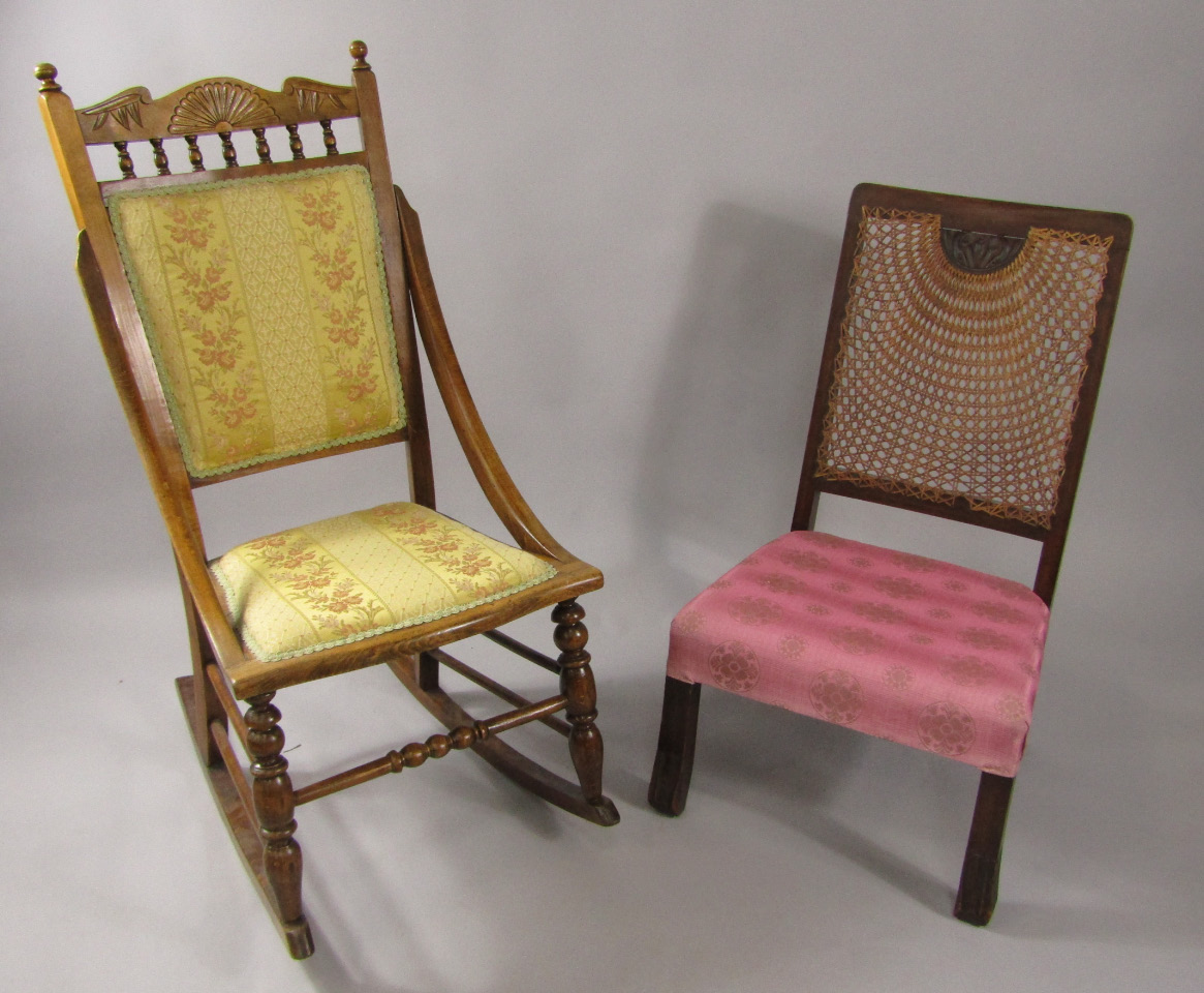 Appraisal: A Victorian oak rocking chair with overstuffed seat and back