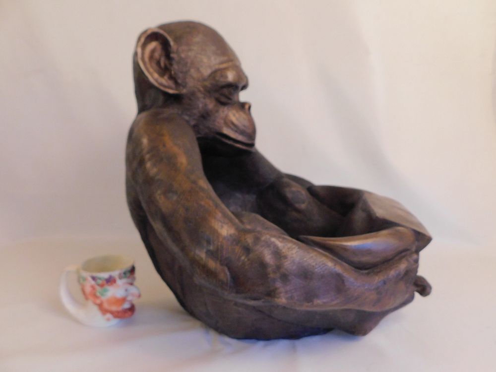 Appraisal: BRONZE BIRD BATH - MONKEY FORM A bronze bird bath