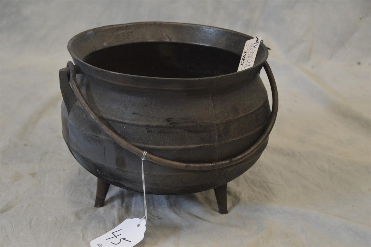 Appraisal: Cast iron cauldron small size swing handle feet marked No