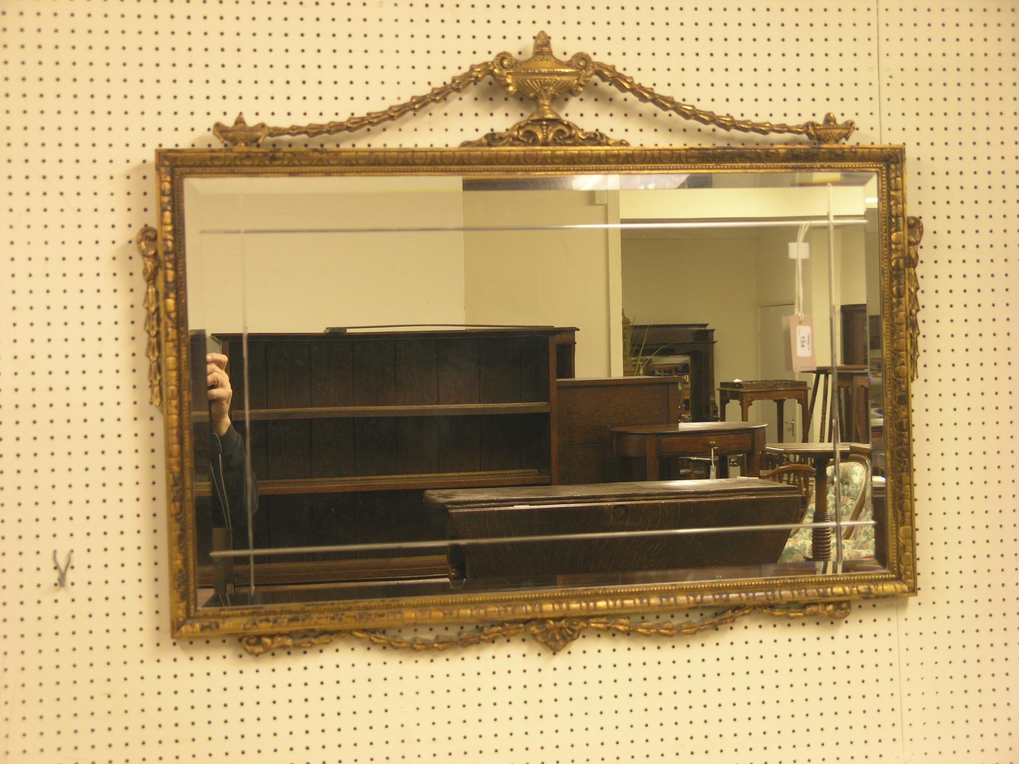 Appraisal: A neo-classical style giltwood mirror rectangular-shape with bevelled plate ft