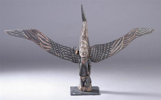 Appraisal: NEW GUINEA POLYCHROME WOOD FIGURE OF MAN AND SEA EAGLE