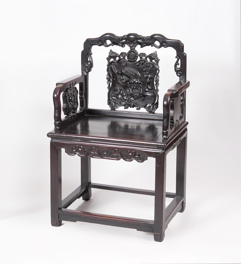 Appraisal: CHINESE CARVED ARM CHAIR Carved and shaped back center splat